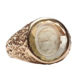ring with carved face